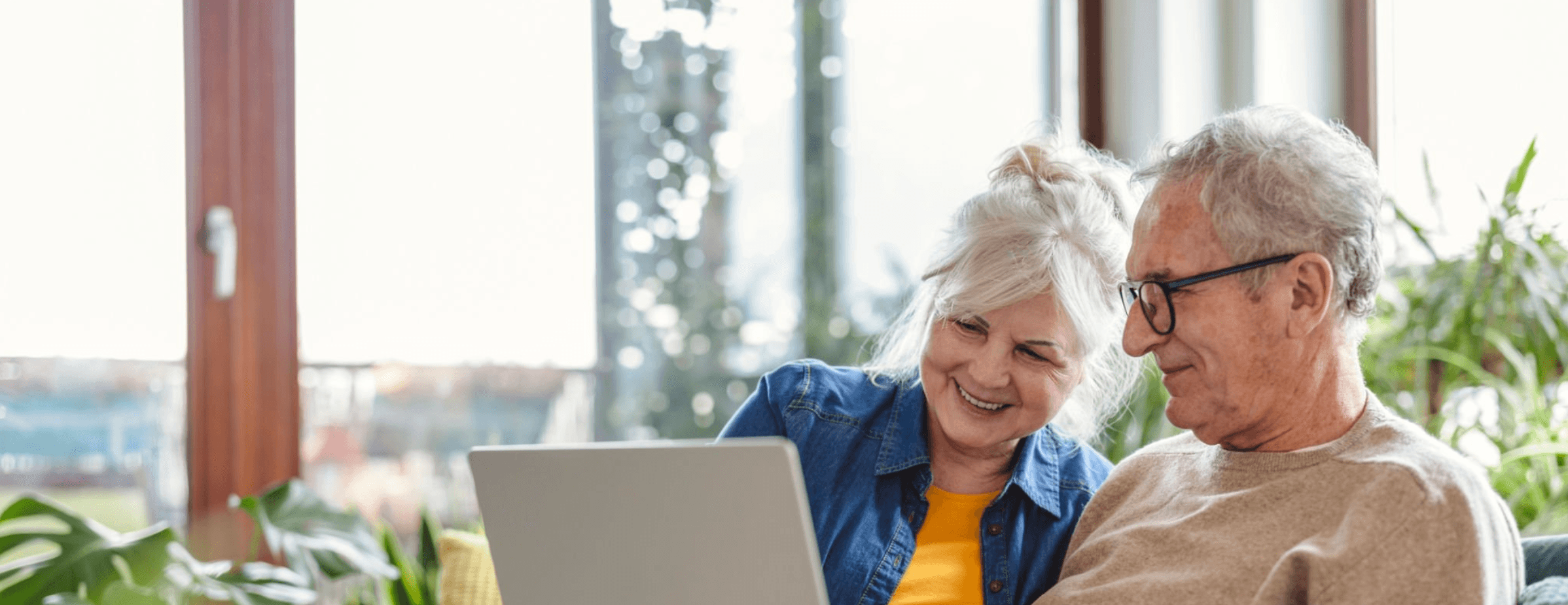 Couple working together on laptop planning for the future